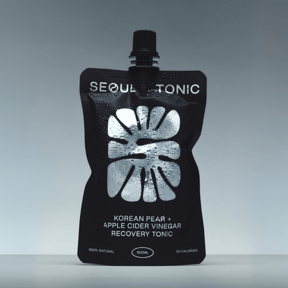 Black pouch of Seoul Tonic with white text on a gray background