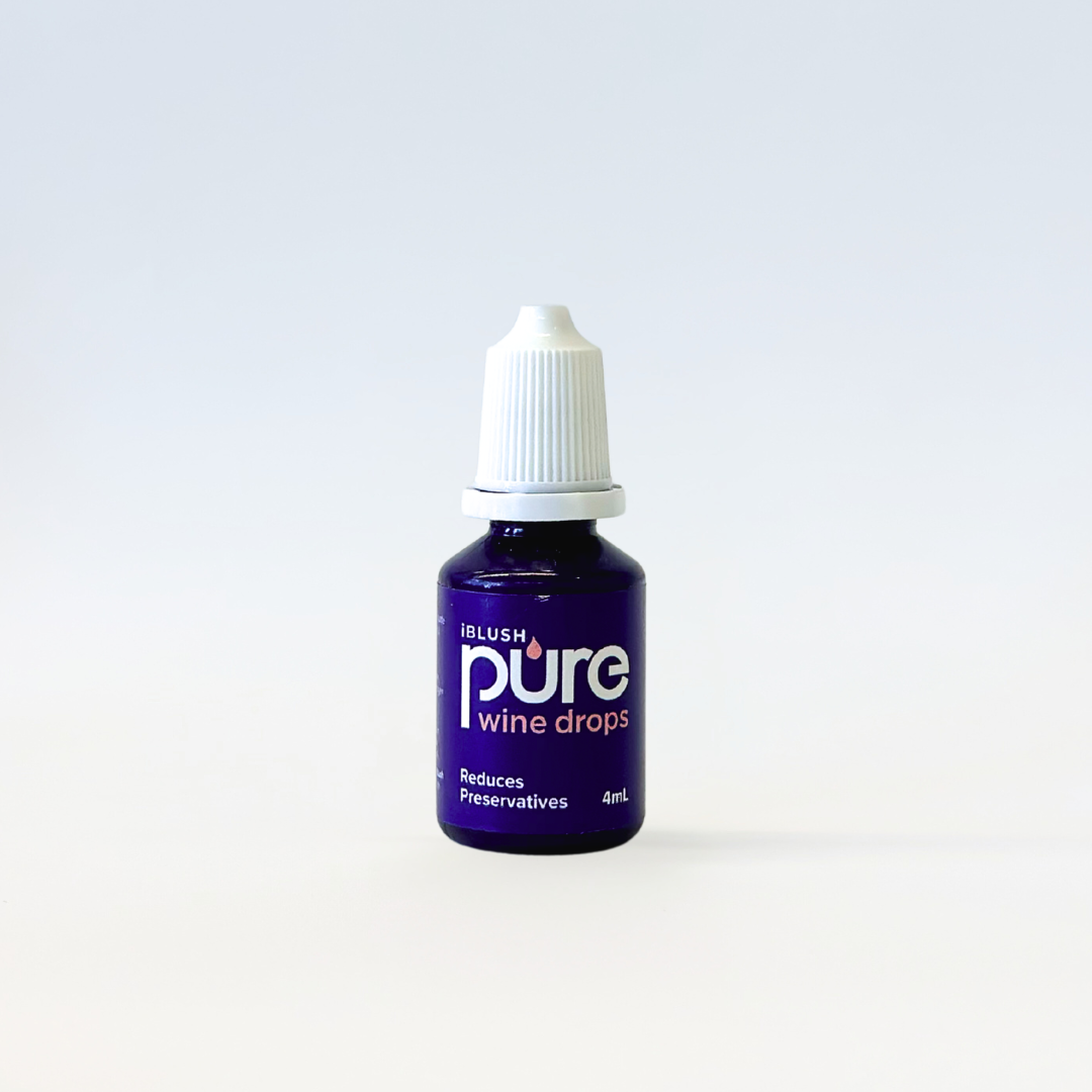 Bottle of 'pure' wine drops on a white background