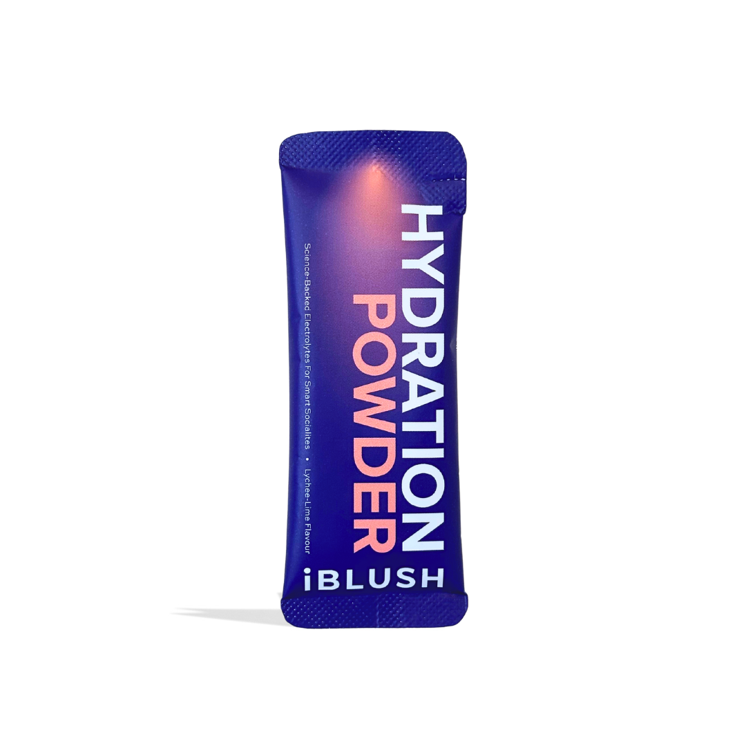 Single iBlush Hydration Powder sachet in lychee lime flavour, a sugar-free electrolyte powder for drinking recovery.