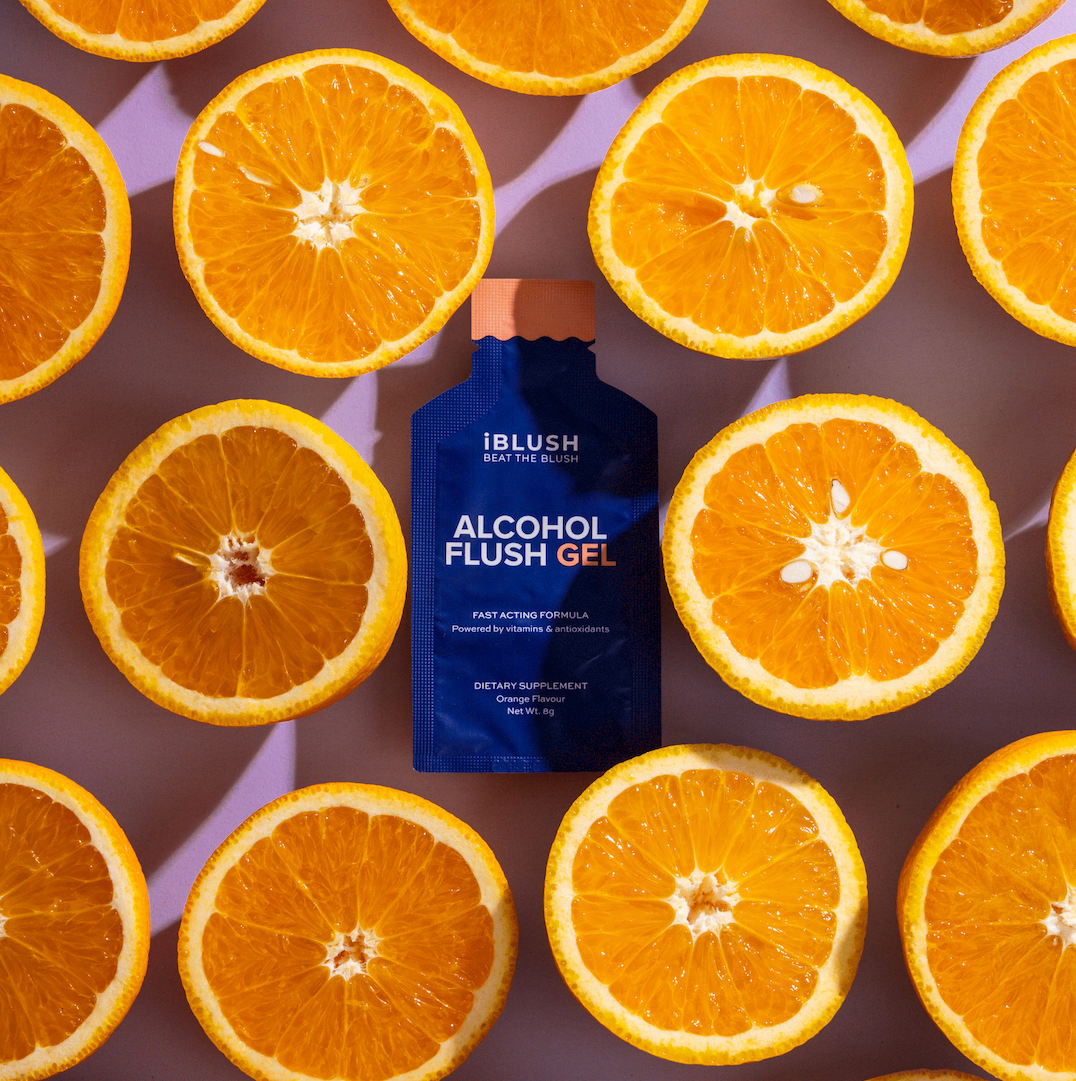 Image displaying iblush alcohol flush gel packaging design with fresh oranges 